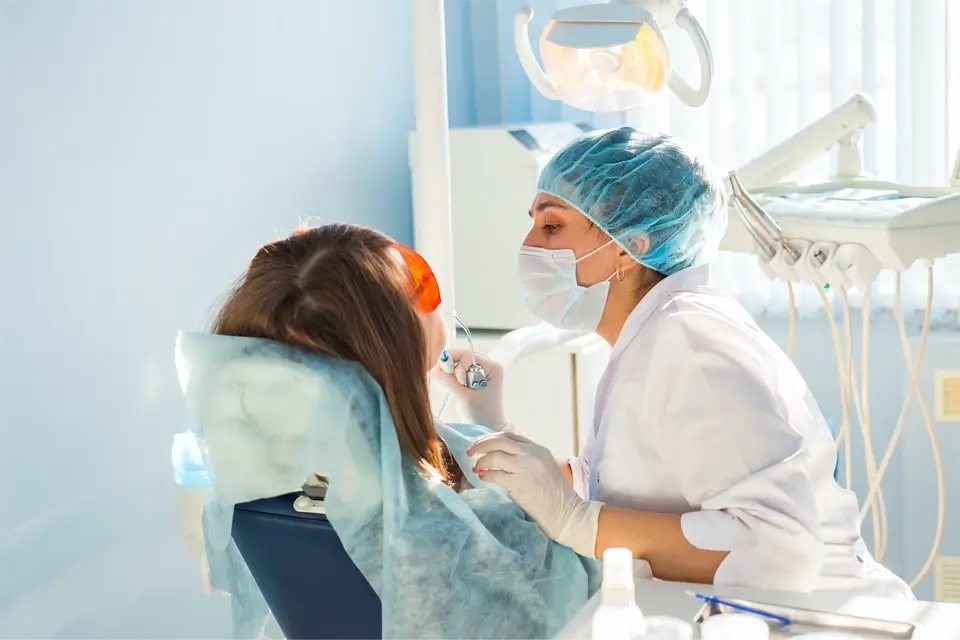 young woman getting dental treatment dental clinic